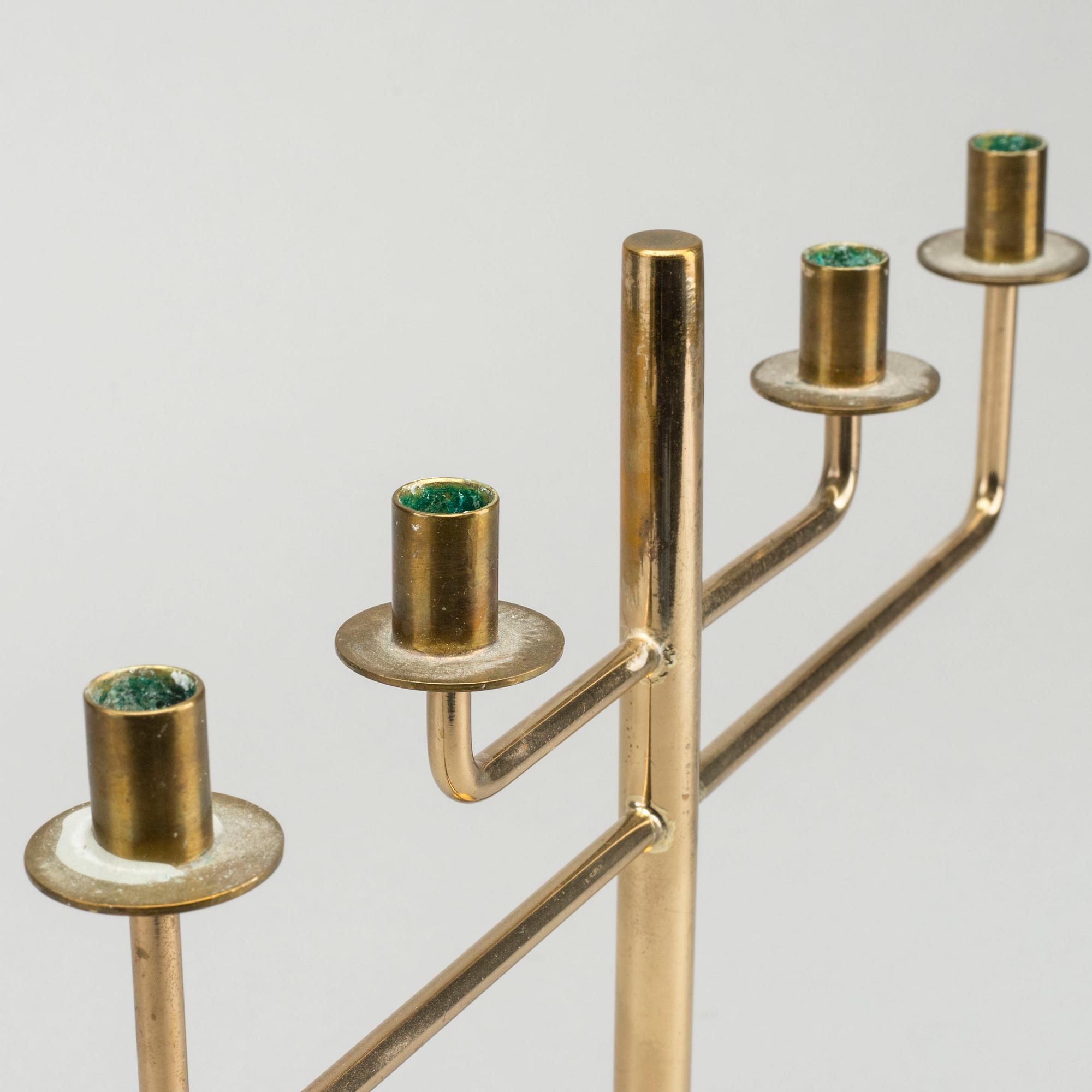 HANS-AGNE JAKOBSSON,  a brass candelabra, later part of the 20th century, height 23,5 cm.