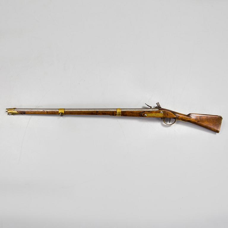 A late 18th century flintlock rifle.