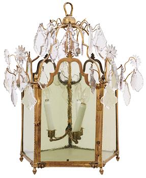 1266. A Russian 18th century Rococo gilt bronze and glass three-light lantern.