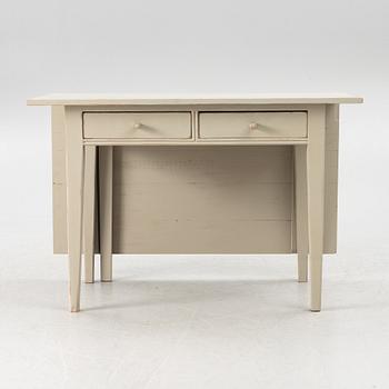 A drop-leaf table, late 19th century.