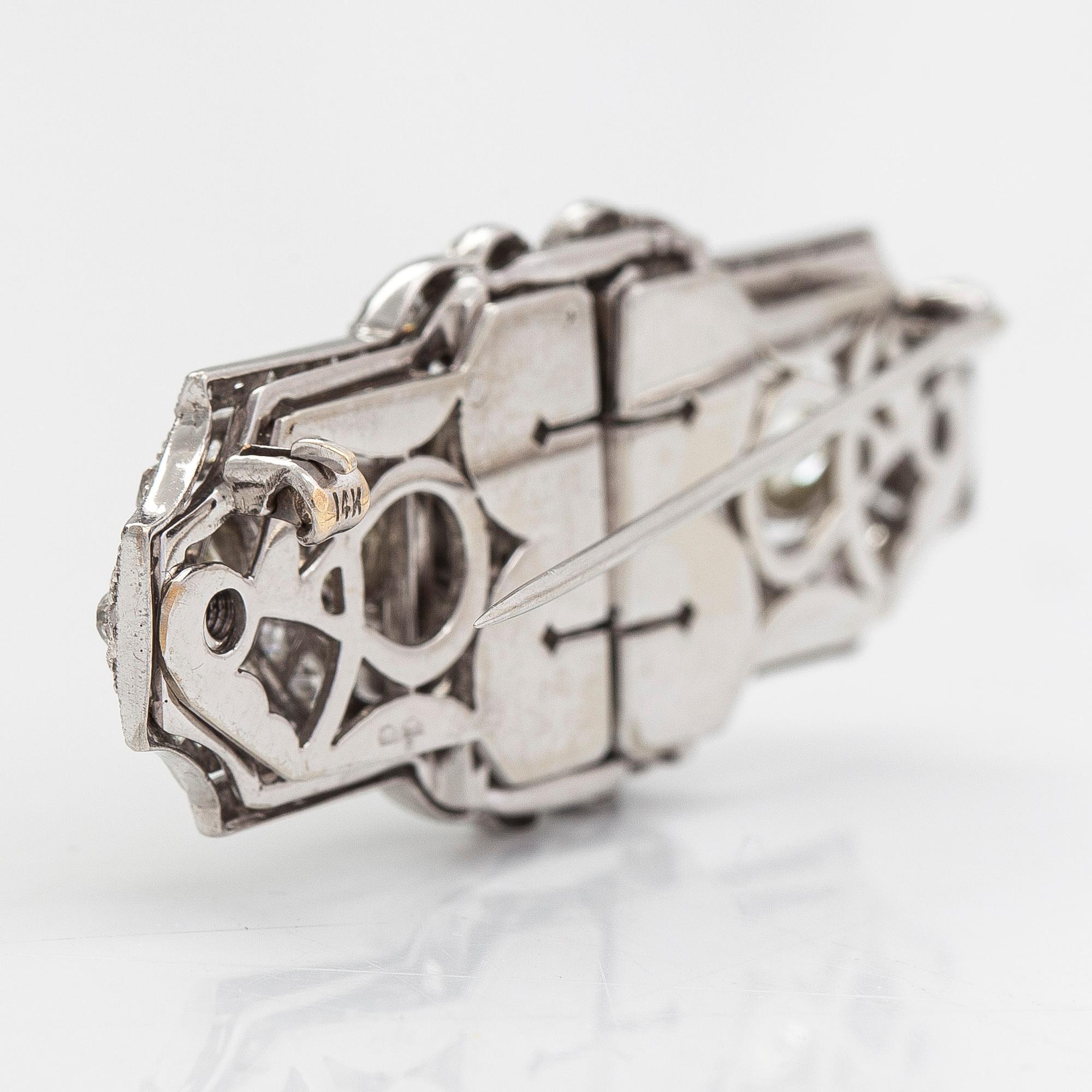 A 14K white gold Art Deco double clip brooch with old-cut diamonds approximately 4.90 cts in total. Austrian importmark.