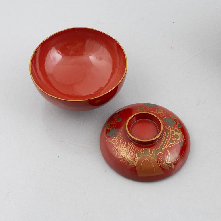 Eleven lacquer-ware bowls with lids, Japan, first half/mid 20th century.