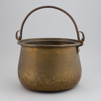 A large 18th century brass cauldron.