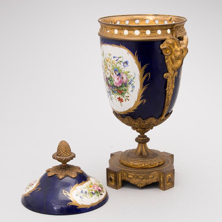A FRENCH SÈVRES STYLE URN, porcelain and gilt bronze, latter half of the 19th century.