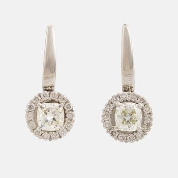 Cushion cut diamond earrings.