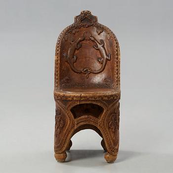 Knut Fjaestad, an Art Nouveau folk art sculptured pine chair, Sweden early 1900's.