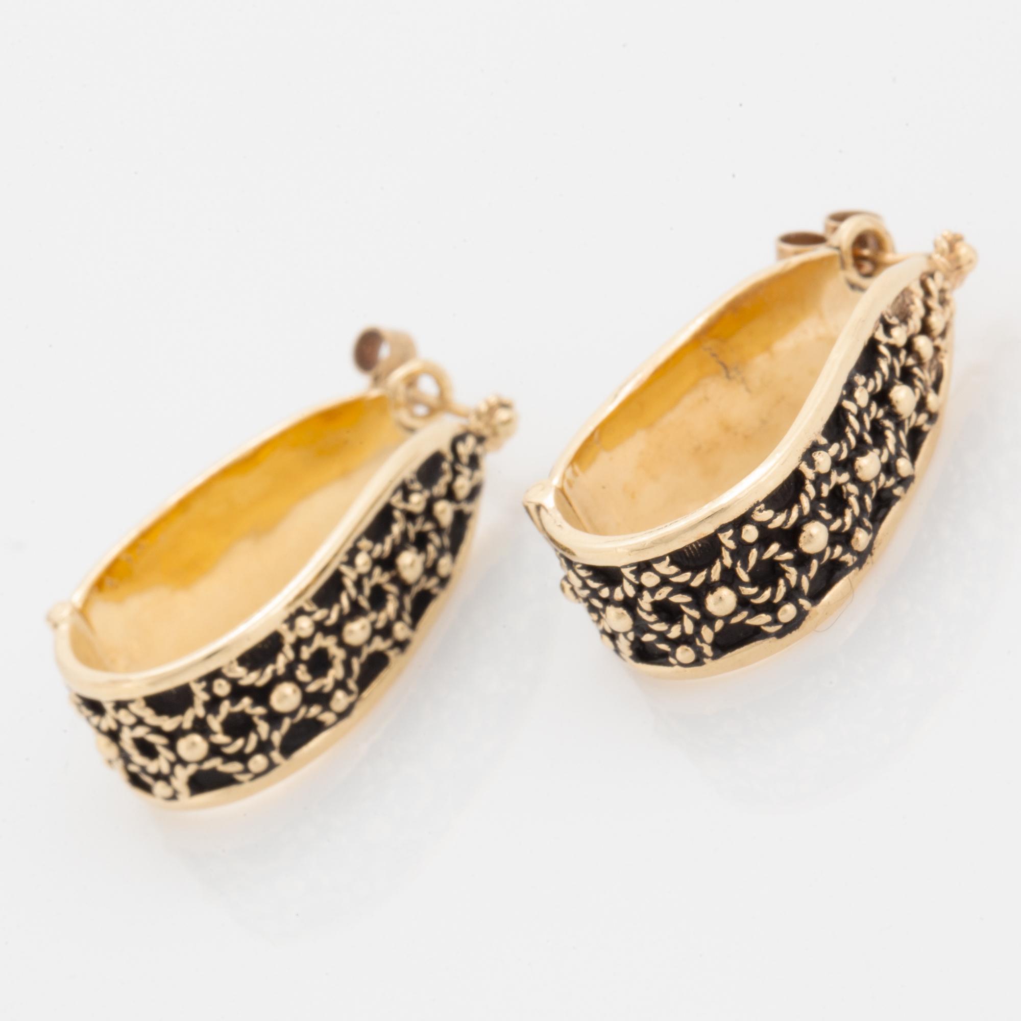 14K gold hoop earrings.