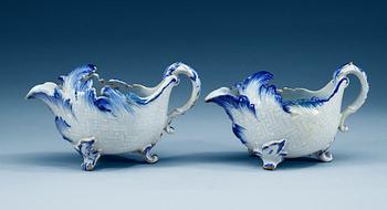 1332. A pair of Swedish Rörstrand faience sauceboats, dated 1/7 (17)65 and 10/8 (17)63.