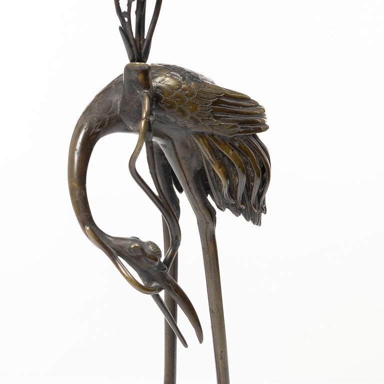 A bronze candle holder, Japan, 20th century.