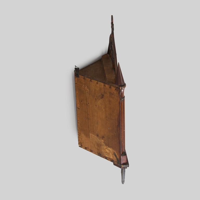 A mid-19th-century wall cabinet.