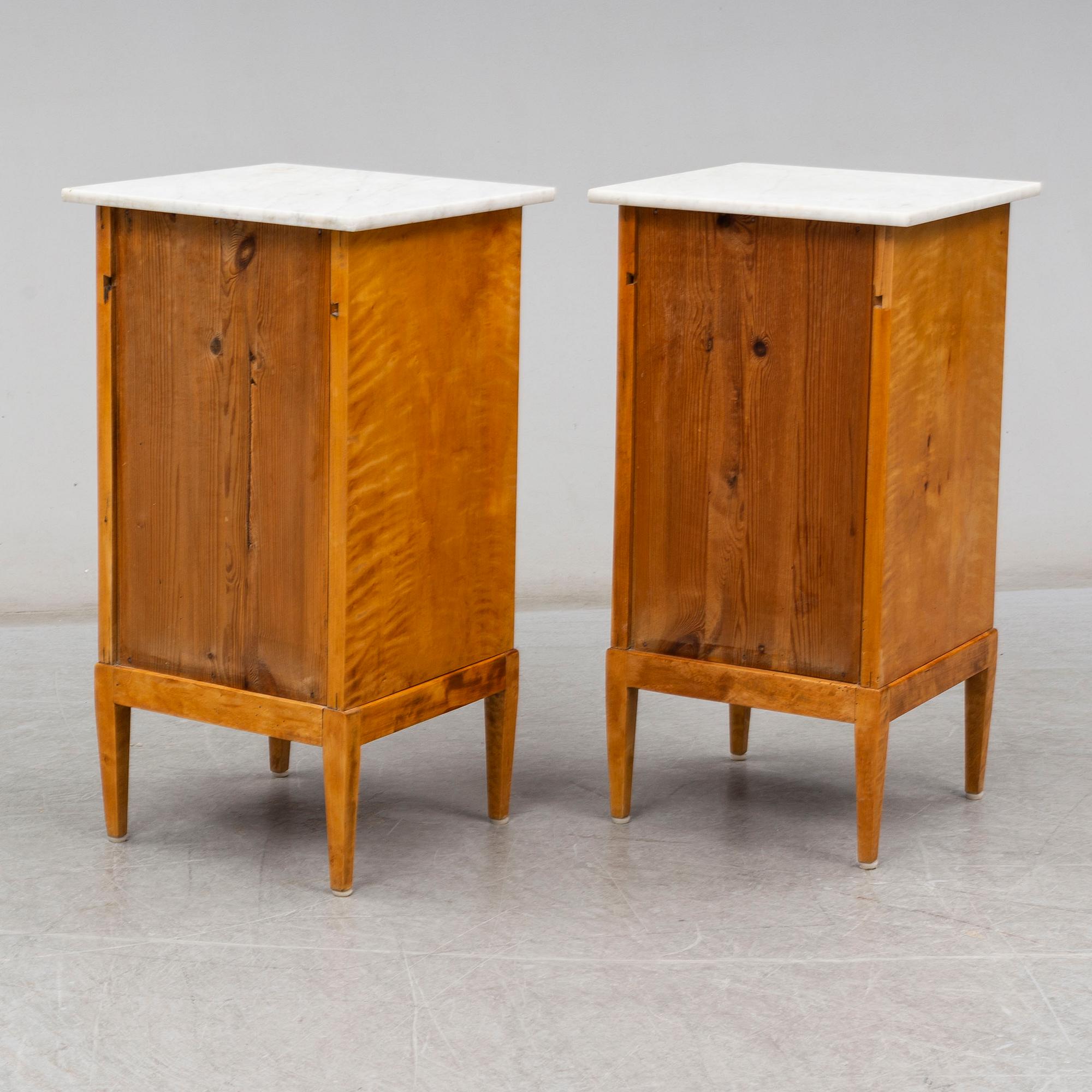 A pair of bedside tables from the first half of the 20th century.