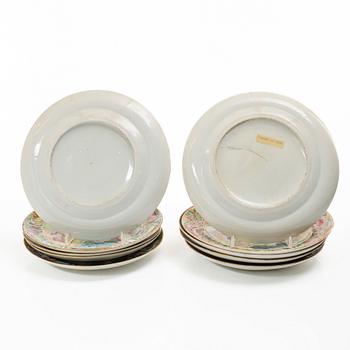 A matched set of 14 famille rose 'Canton' dinner plates, Qing dynasty, 19th century.