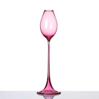 Nils Landberg, a cerise tinted glass goblet, Orrefors Sweden 1957.