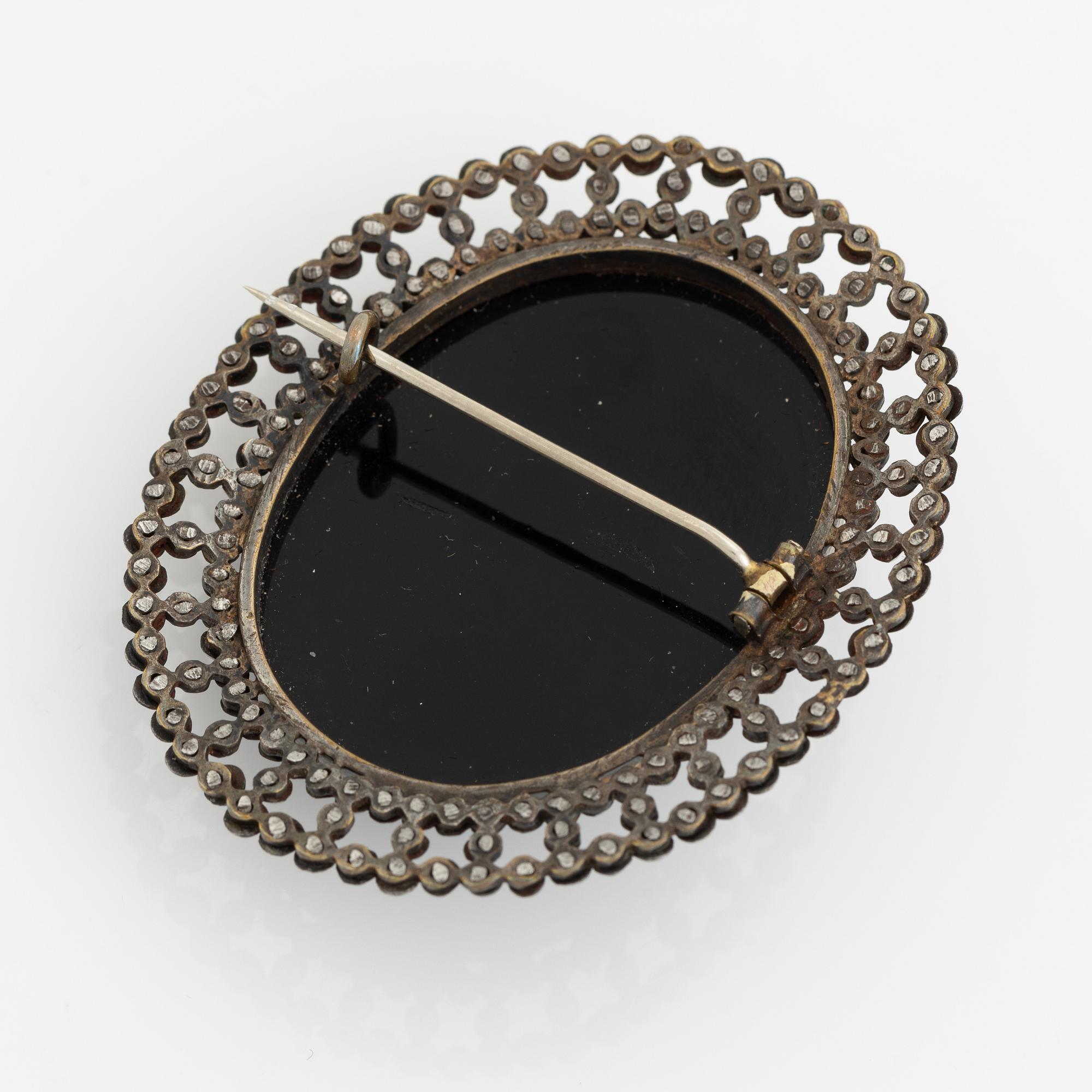 Black stone brooch hotsell