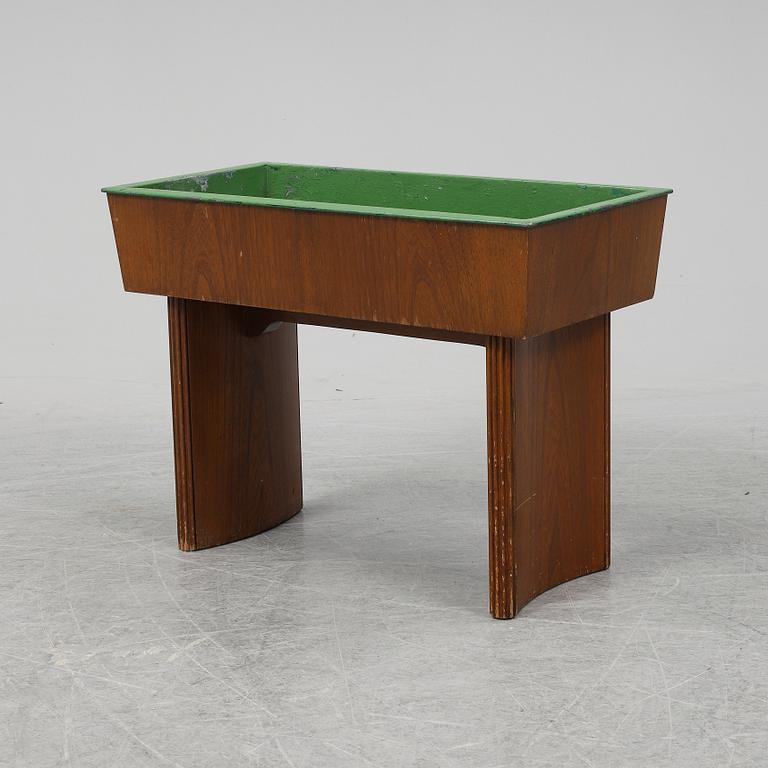 NORDISKA KOMPANIET, possibly be Carl Axel Acking, an oak plant stand from 1942.