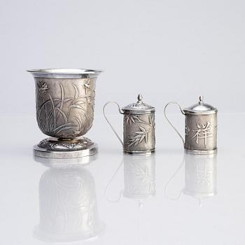 A Chinese Export silver beaker and two silver mustard pots, early 20th century.