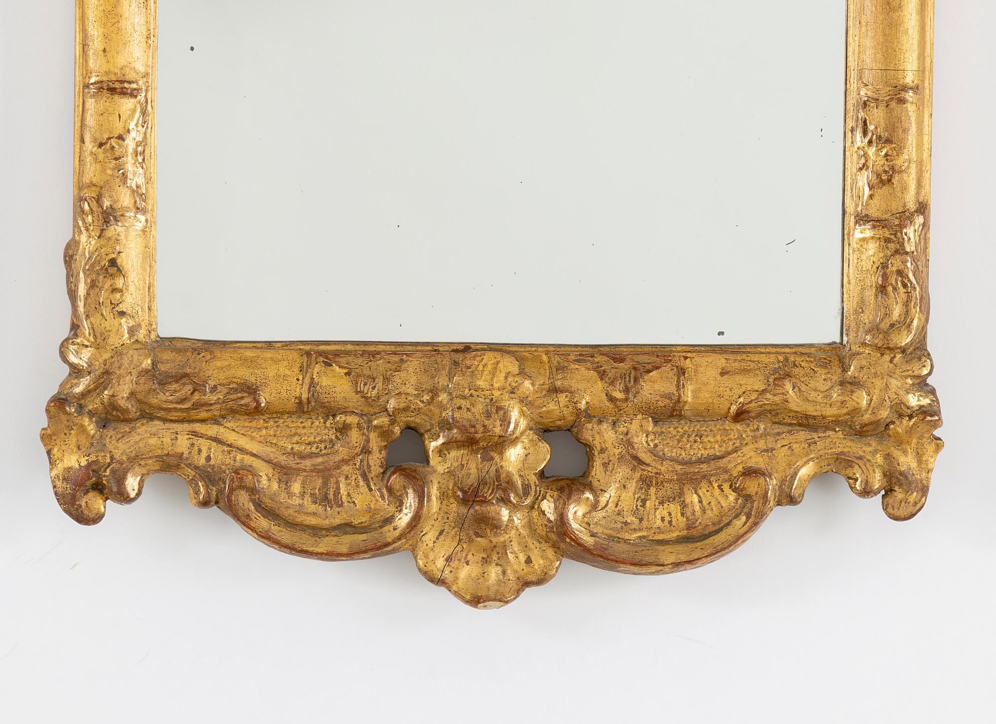 A mid 20th century Rococo style mirror.