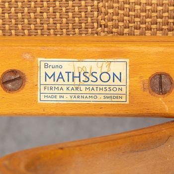 An mid 20th Century easy chair  and stool by Bruno Mathsson for Karl Mathsson Värnamo.