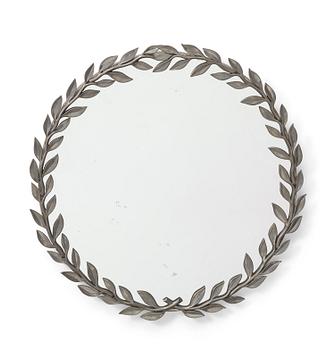 An Estrid Ericson pewter laurel leaves-framed mirror, Svenskt Tenn, Stockholm 1946.