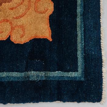 A carpet, a semi-antique Chinese,  ca 255 x 199-202,5 cm.