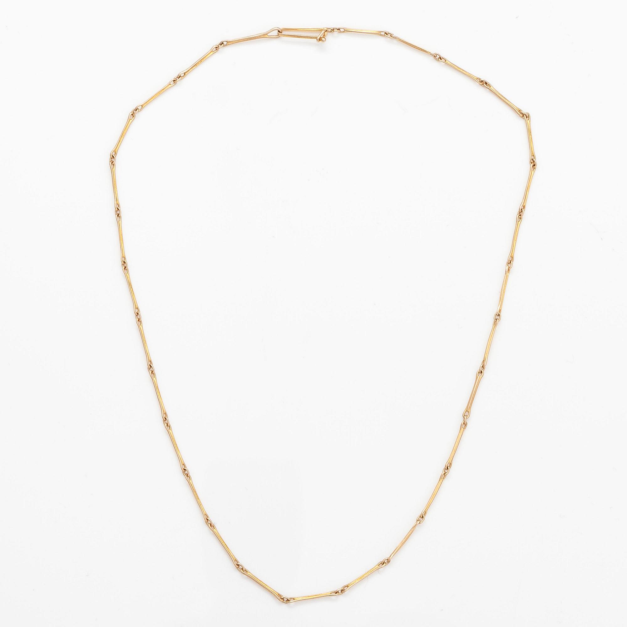 BJÖRN WECKSTRÖM, A 14K gold pendant "Reindeer clock" with an amethyst and chain "Raito". Lapponia 1978  and 1982.