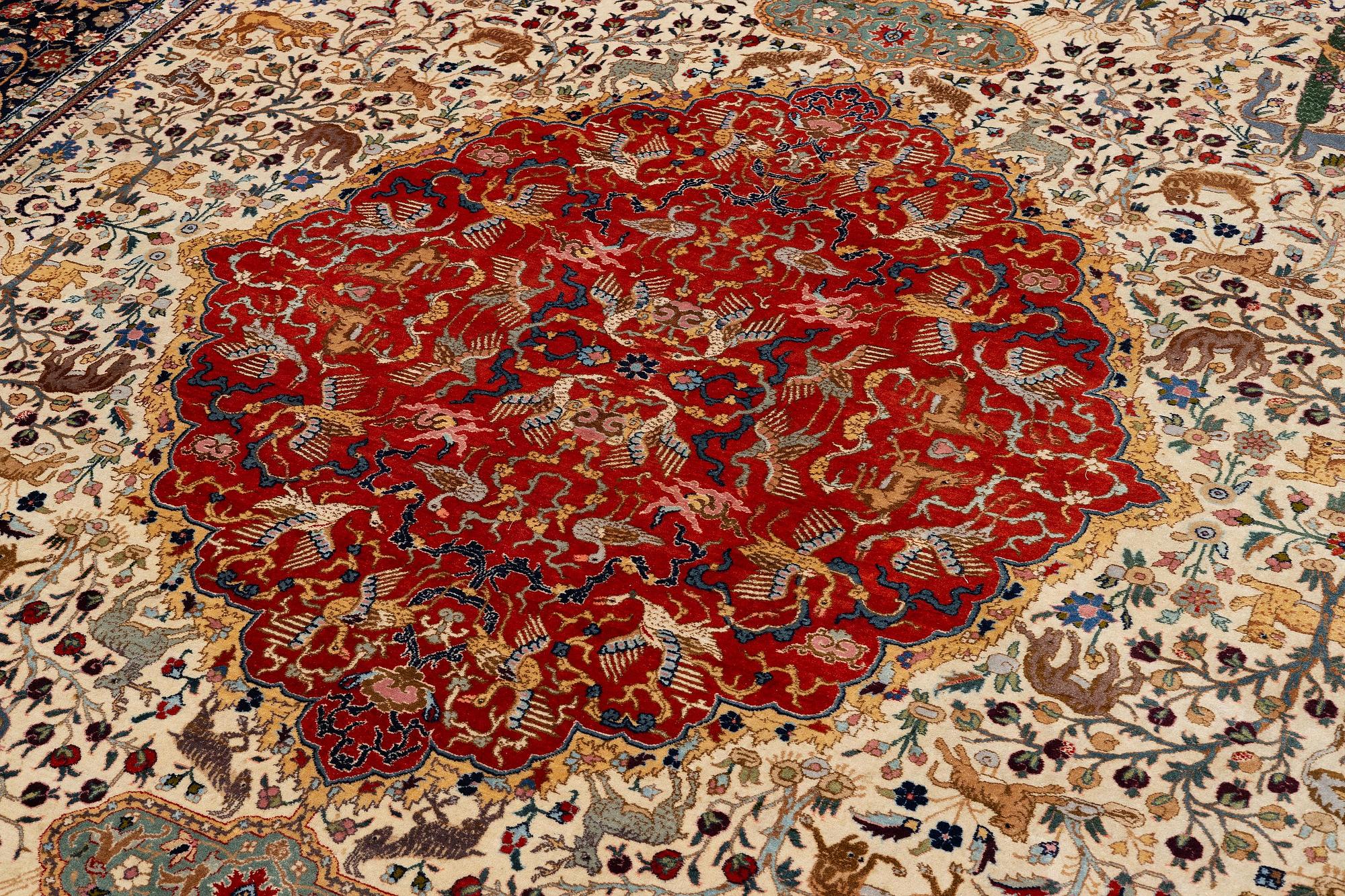 A semi-antique Benlian Tabriz carpet of 'Coronation' design, signed Jabarzade, c. 488 x 367 cm.