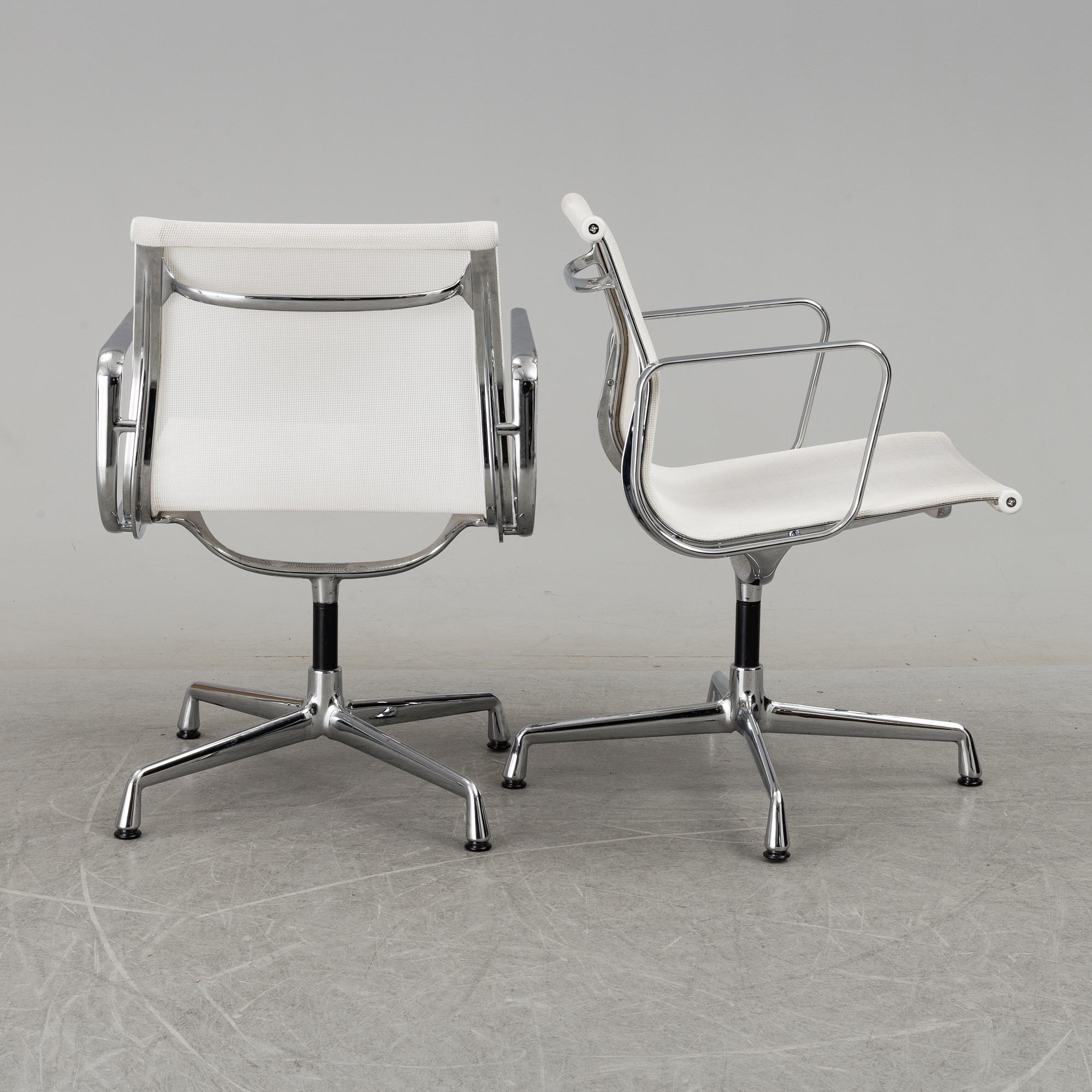 A pair of 'EA 108' desk chairs by Charles & Ray Eames for Vitra.