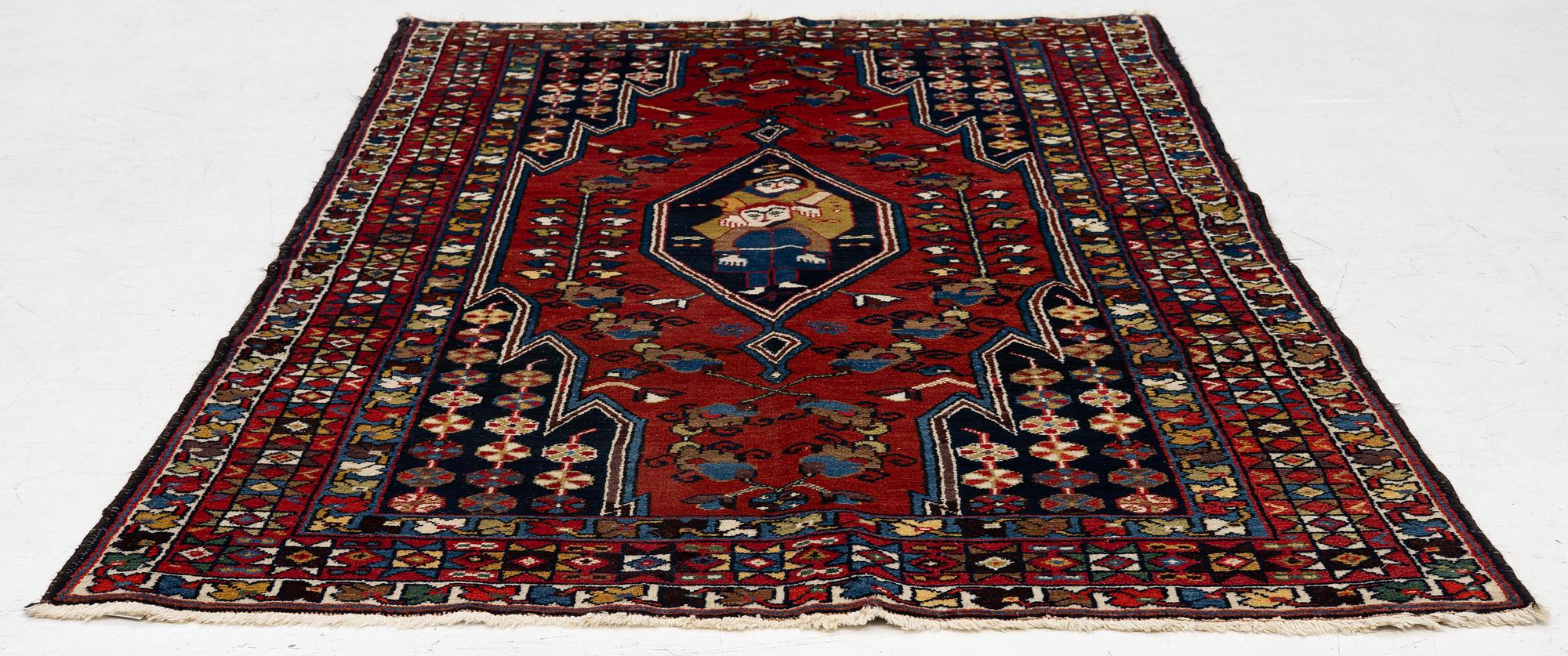 A semi-antique pictoral Mazlagan rug, Northwest Iran, c. 195 x 125 cm.