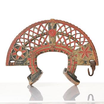 A Swedish folk art carved and polychrome-painted part horse harness, Uppland, dated 1774.