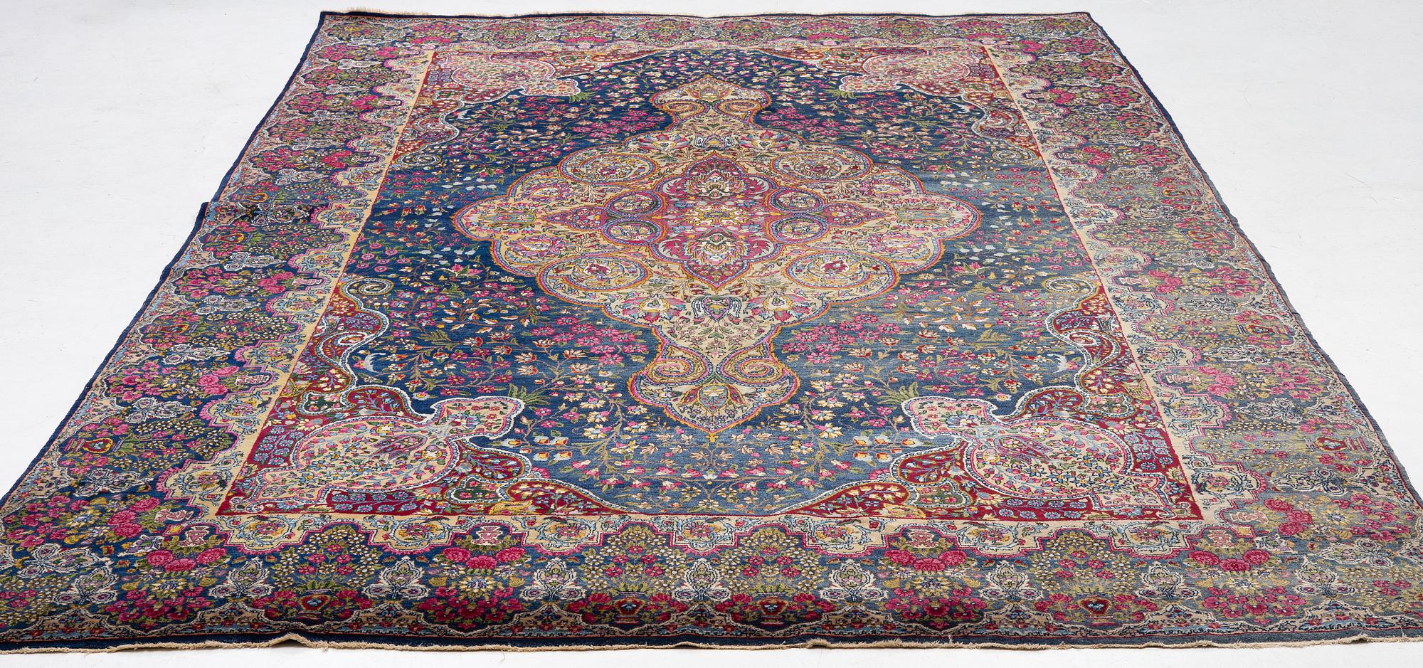 A semi-antique Kirman carpet, south Persia, c. 440 x 279 cm.