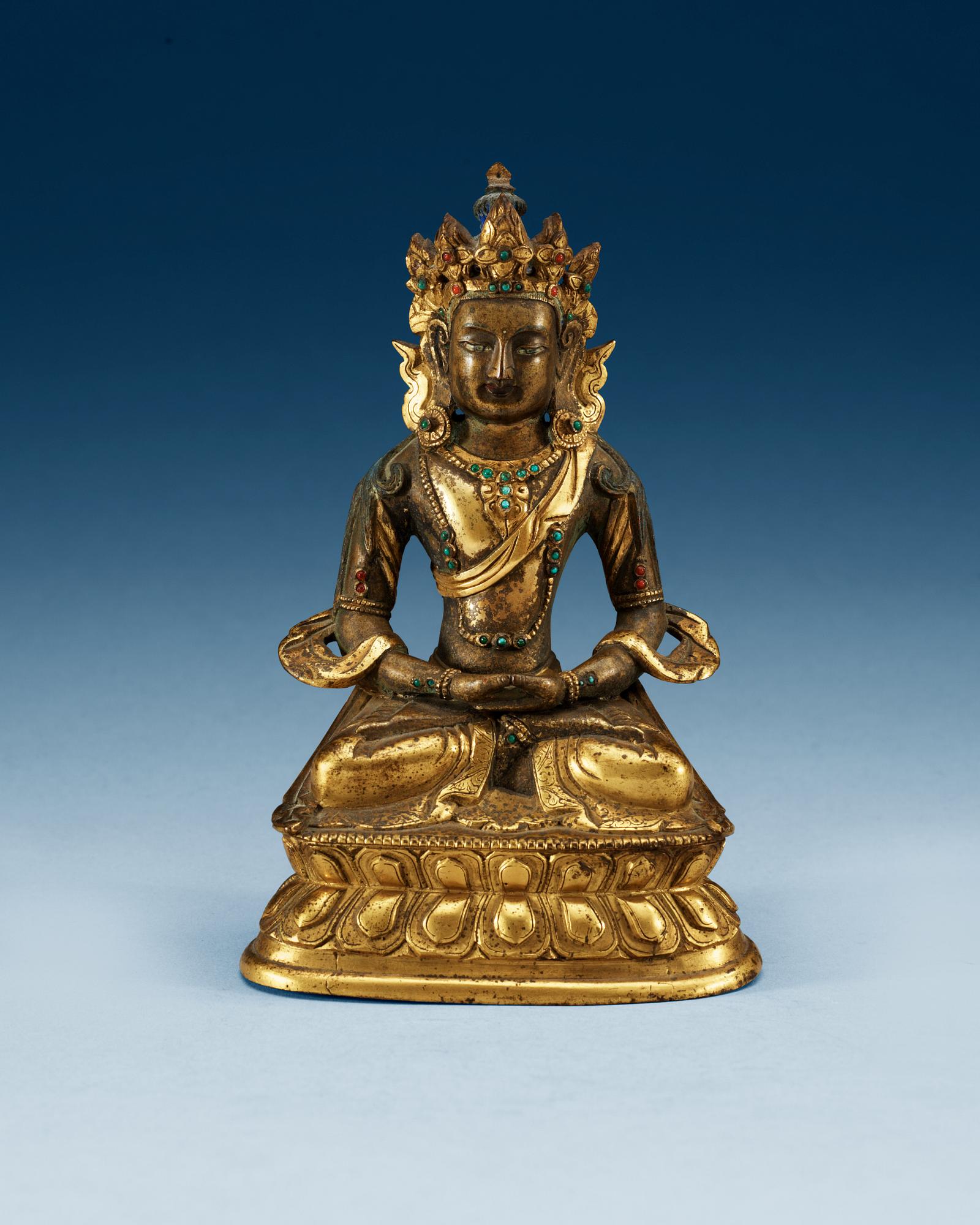 A partial-gilt bronze figure of Avalokiteshvara, Sino-Tibetan, 18th Century.