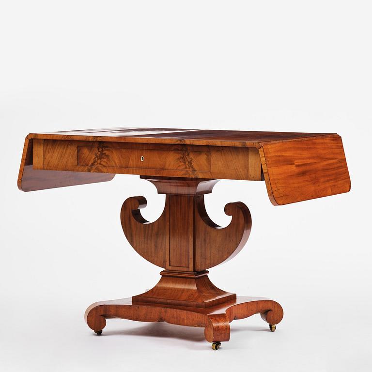 A Swedish Empire mahogany center table.