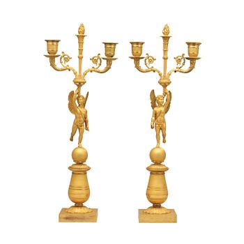 550. A pair of French Empire early 19th century two-light candelabra.