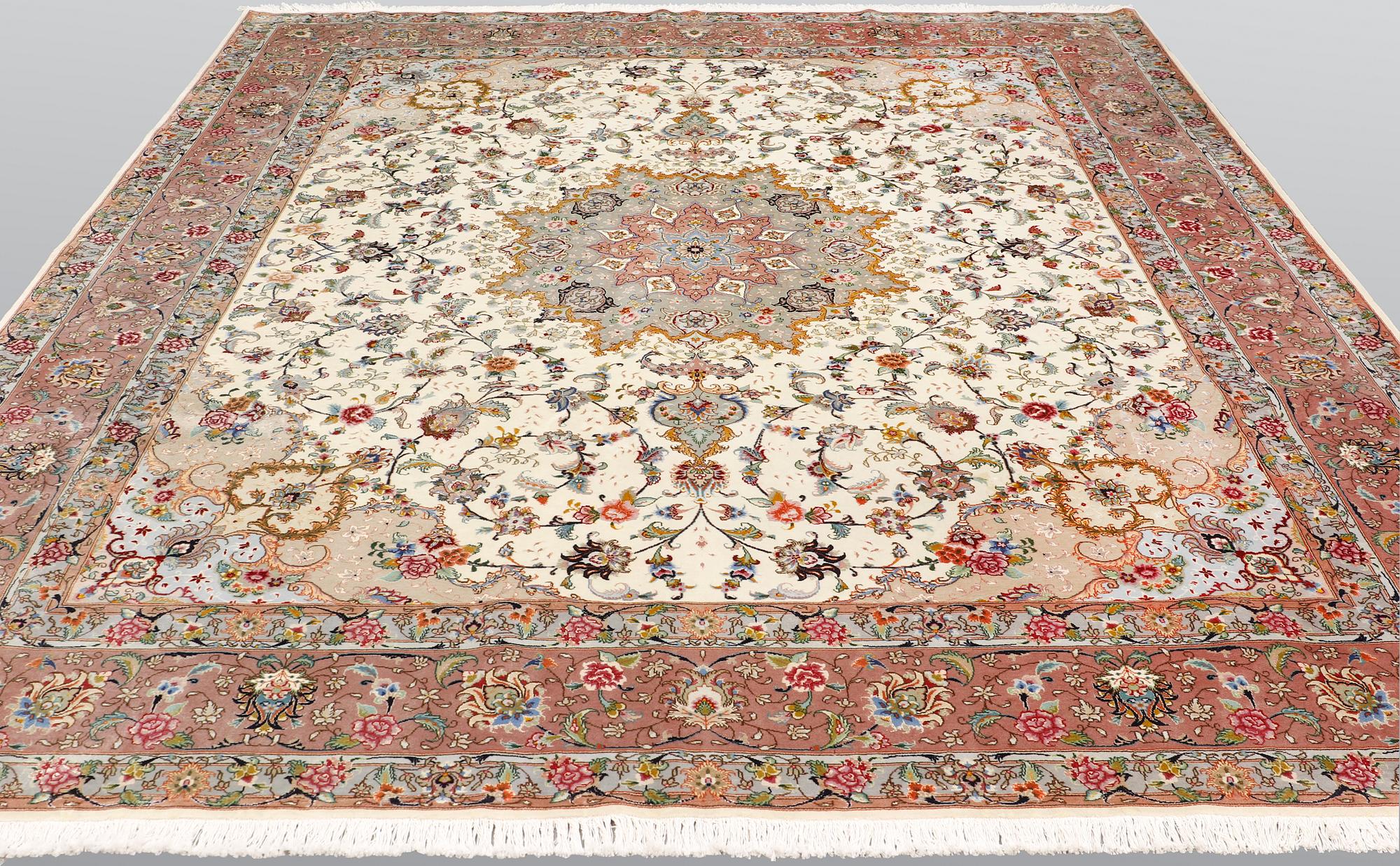 A Tabriz part silk carpet, 297 x 253 cm.
