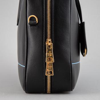 PRADA, a leather bag.