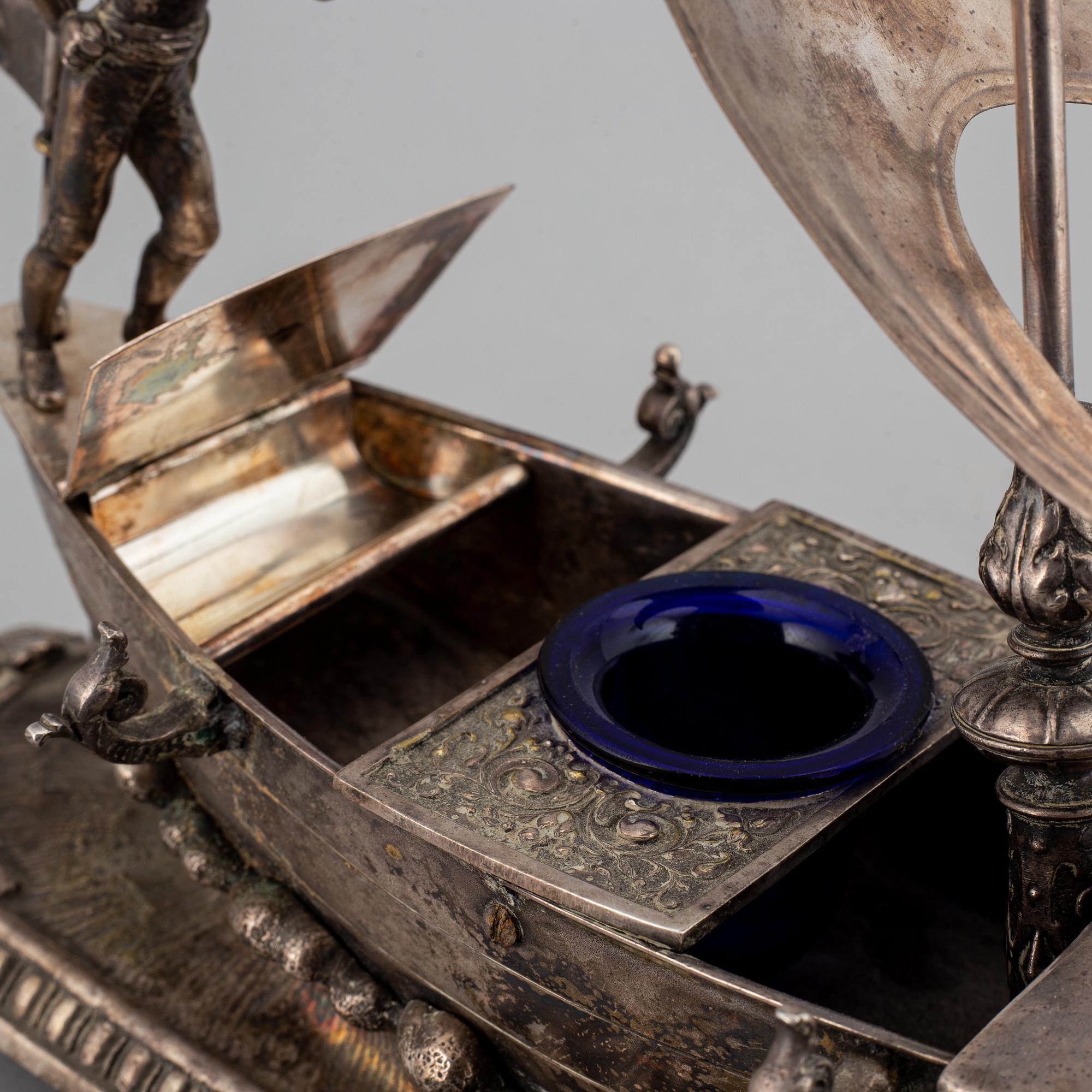 A silver plated inkwell, circa 1900.
