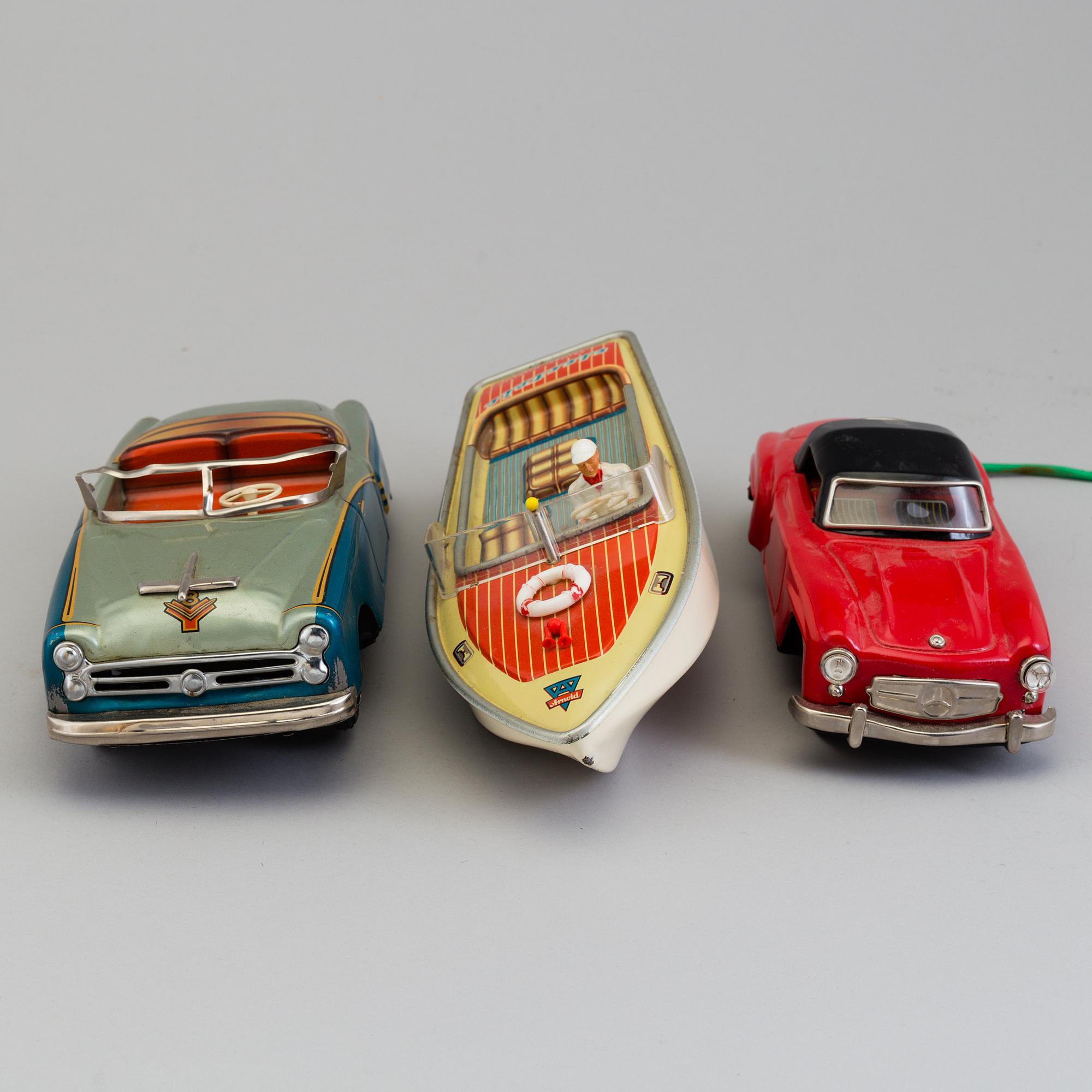 THREE TIN PLATE TOYS, mid 20th century.