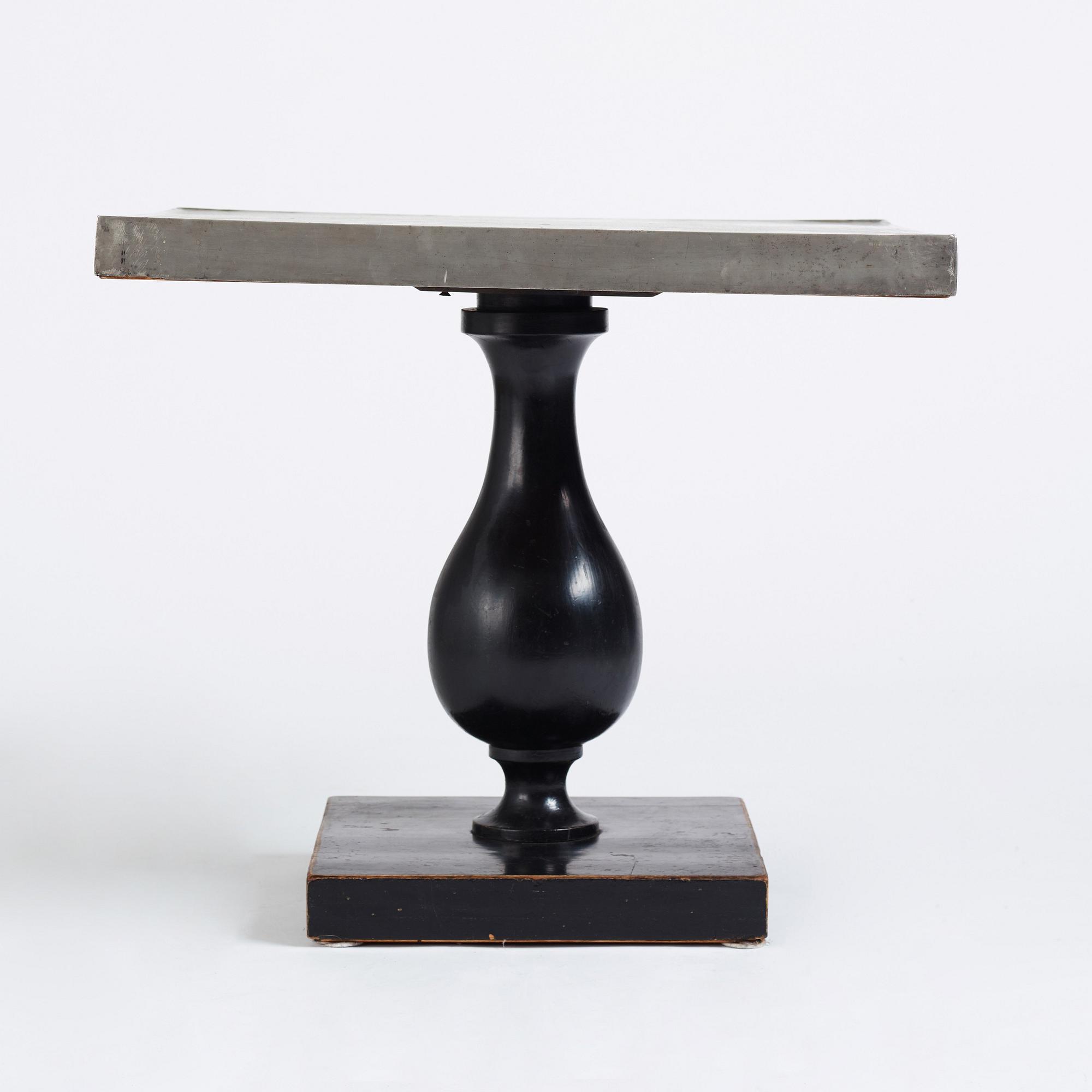 Uno Åhrén, a black lacquered table with a pewter top by Nils Fougstedt, Svenskt Tenn ca 1930. Alva & Gunnar Myrdal Collection.