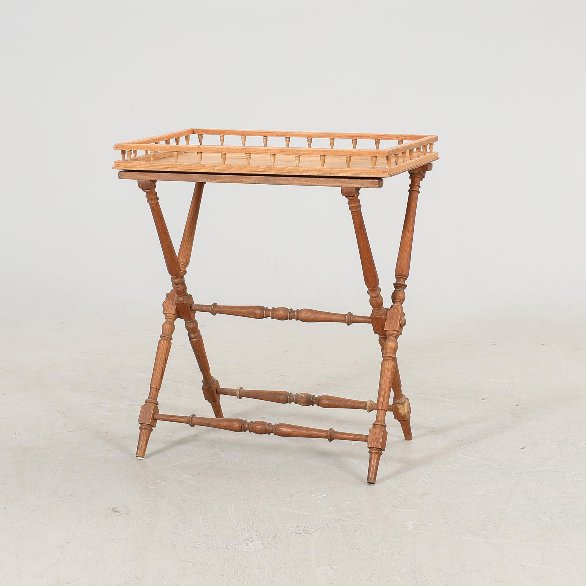 An oak tray table around 1900.
