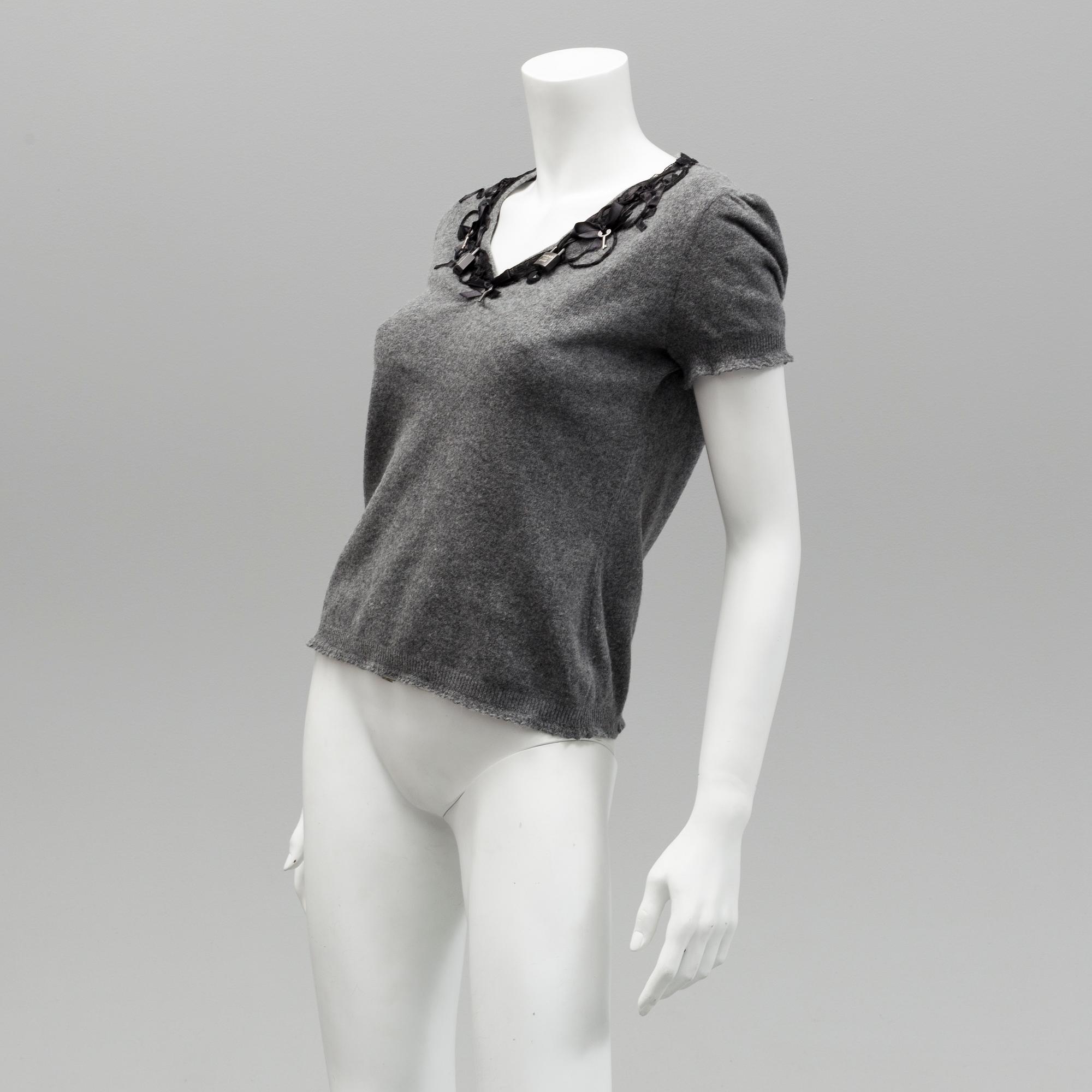 Cardigan and top by Moschino, Cheap and Chic.