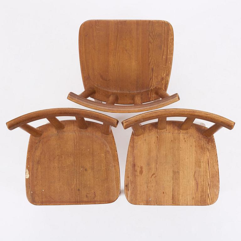 Axel Einar Hjorth, a set of three stained pine "Utö" chairs, Nordiska Kompaniet, Sweden, 1930s.