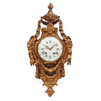 541. A Louis XVI 18th century gilt bronze wall clock by Cellier.