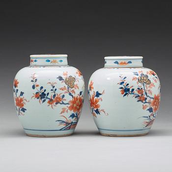 A pair of imari jars with covers, Qing dynasty, 18th Century.