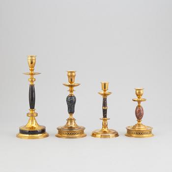 Carl Hjalmar Norrström, four brass and stone candle holders, Skultuna, all numbered 224/300, 1997.