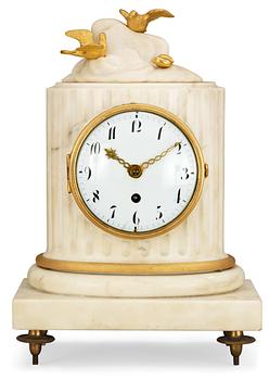639. A Louis XVI late 18th century marble and gilt bronze mantel clock.