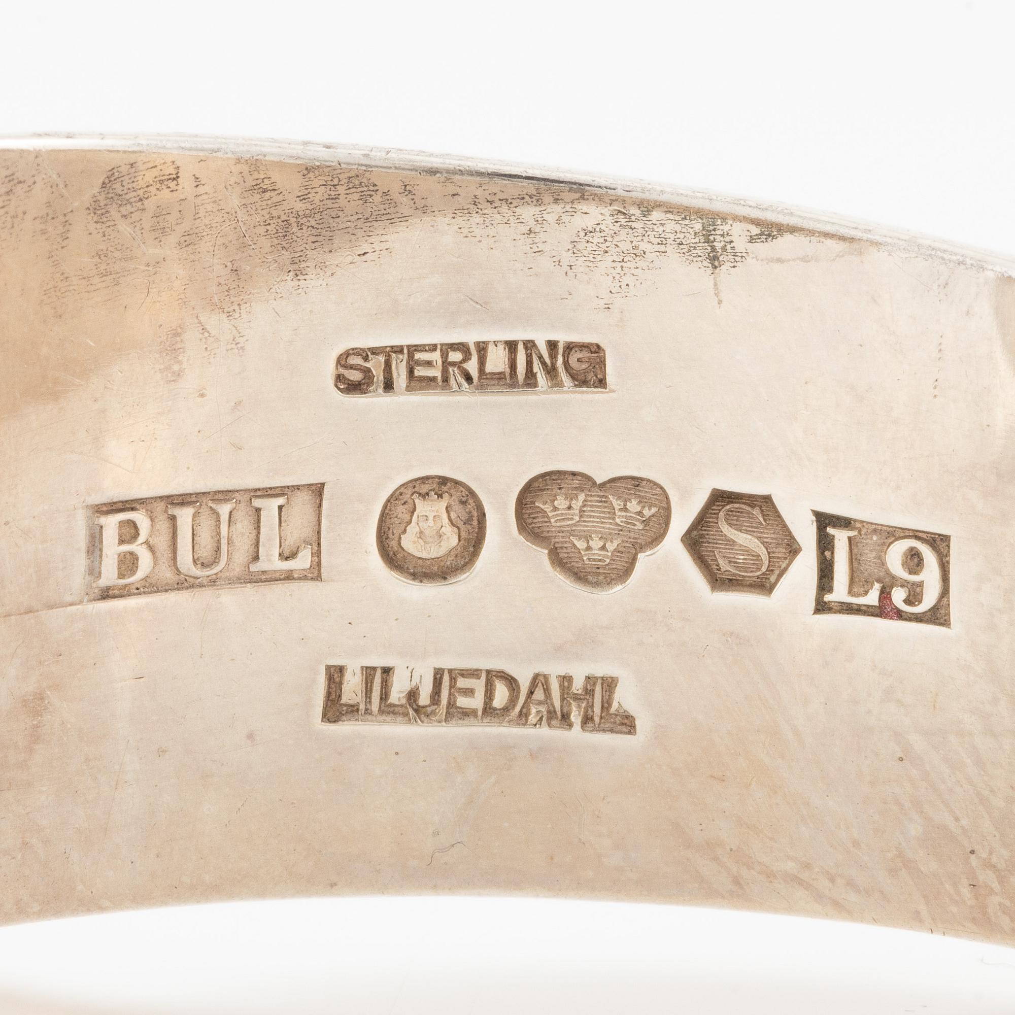 Bengt Liljedahl, arm ring, silver with light yellow stone.