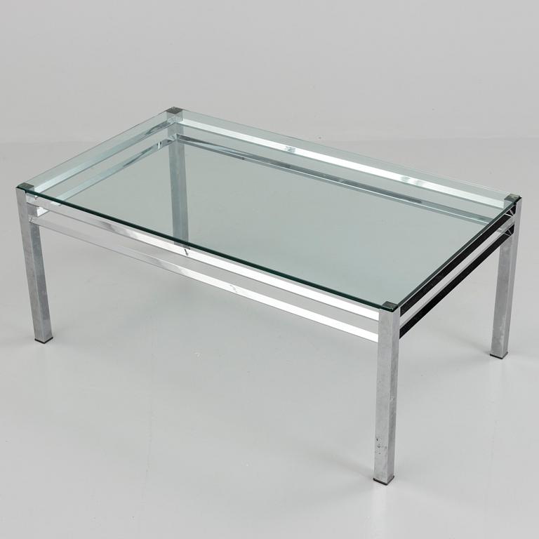 A 1980´s metal table with glass top.