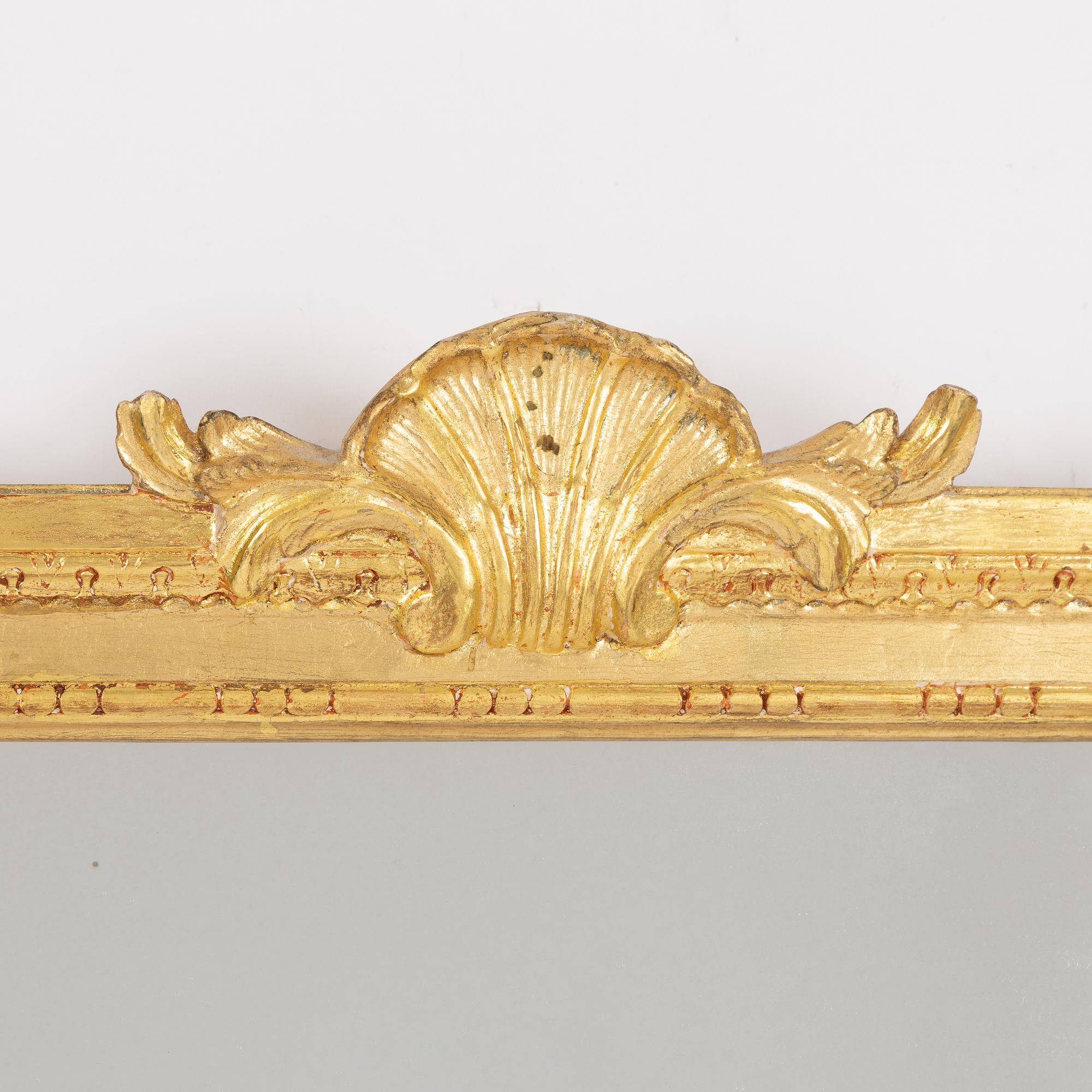 A "Meunier" mirror wall lamp from IKEA's 18th-century series, late 20th century.