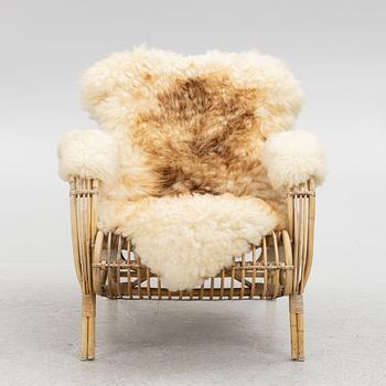 A Scandinavian cane armchair, mid 20th century.