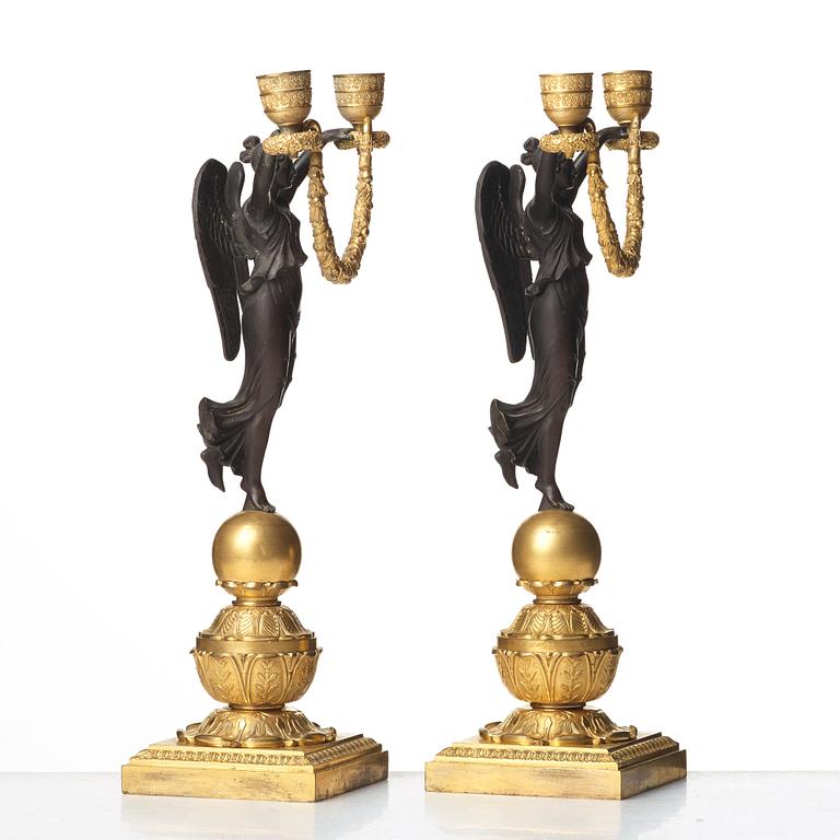 A pair of Empire two-light candlesticks, beginning of the 1800's.